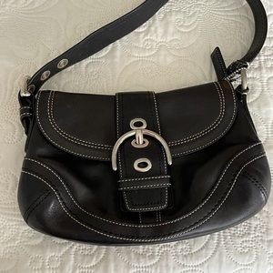 Black shoulder hobo bag by coach,
